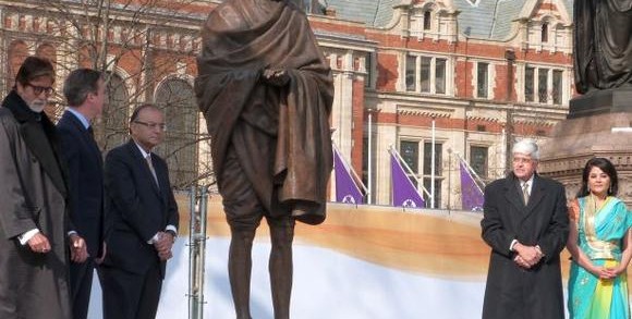 A new statue of Mahatma Gandhi by British sculptor Philip Jackson is unveiled by Finance Minister Arun Jaitley. Also seen are Bollywood actor Amitabh Bachchan, British Prime Minister David Cameron and Gandhi's grandson Gopalkrishna Gandhi, in Parliament Square, London on, Saturday, March 14, 2015.