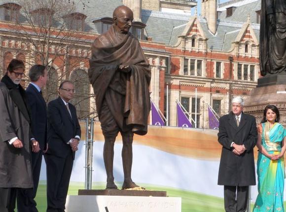 A new statue of Mahatma Gandhi by British sculptor Philip Jackson is unveiled by Finance Minister Arun Jaitley. Also seen are Bollywood actor Amitabh Bachchan, British Prime Minister David Cameron and Gandhi's grandson Gopalkrishna Gandhi, in Parliament Square, London on, Saturday, March 14, 2015.
